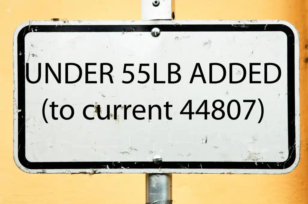 Road sign reading Under 55lb Added to current 44807 for FAA drone exemption filing
